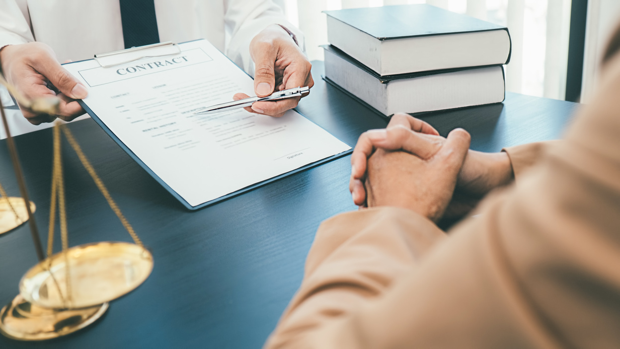 Lawyer Showing Client a Contract 